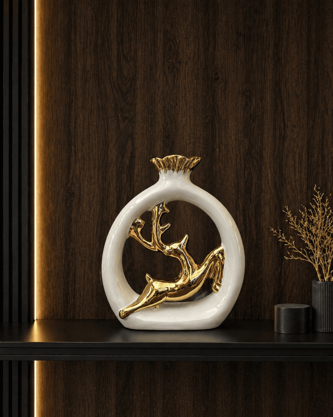 Modern white circular showpiece featuring a golden leaping deer, placed on a wooden wall shelf for elegant living room decor